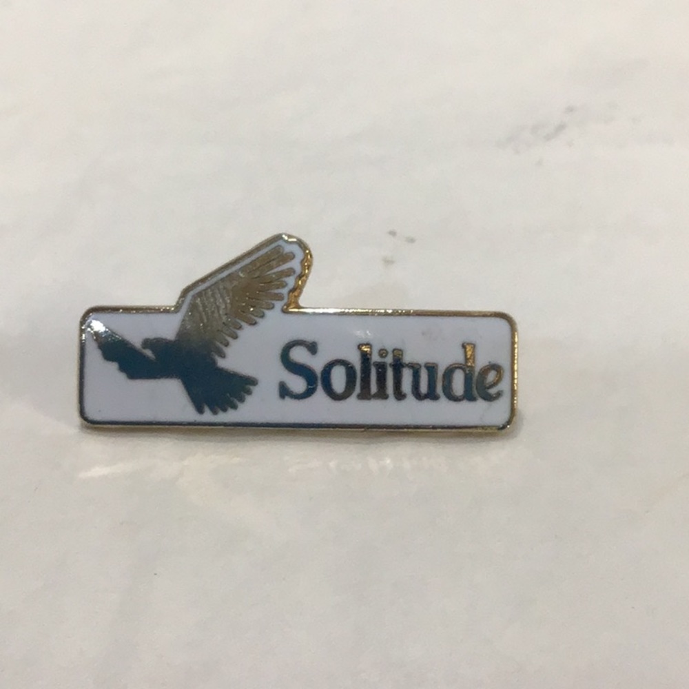 “Solitude” pin with dove in flight